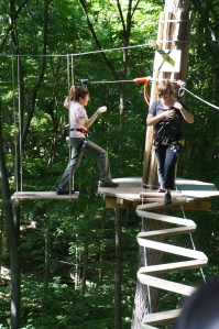 Pam and Kait crossing from tree to tree